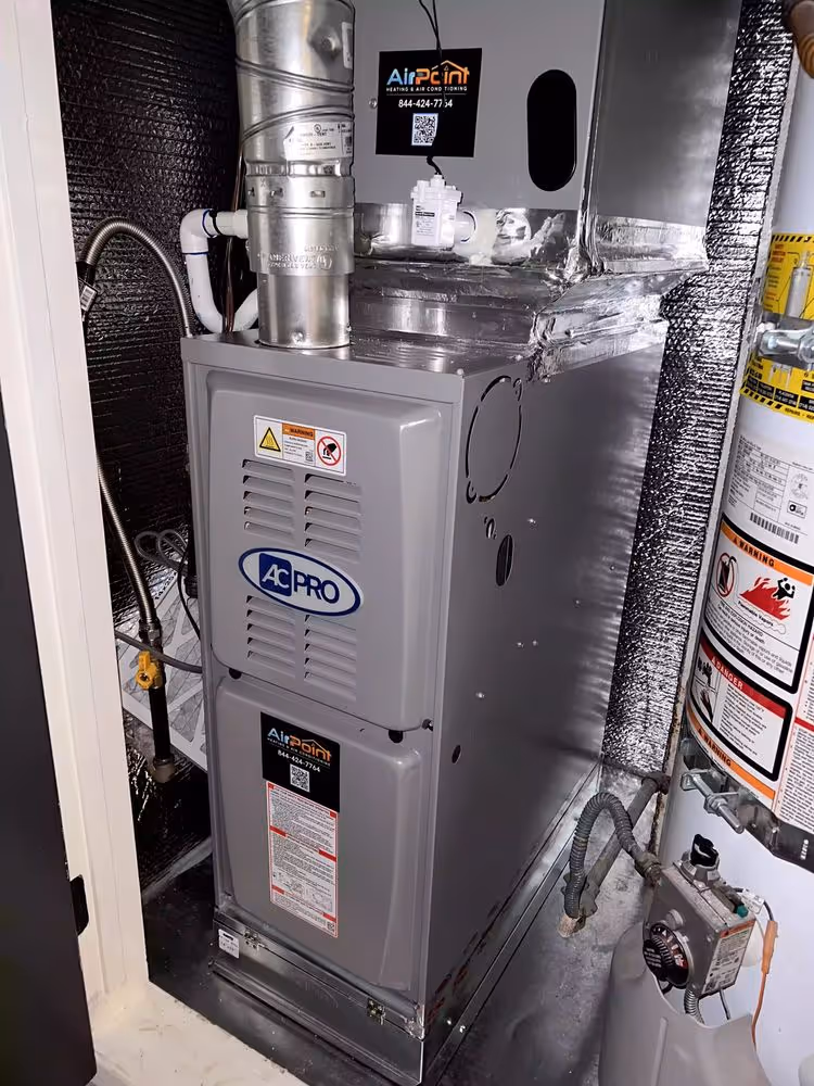 AC Pro furnace system installed indoors by AirPoint Heating & Air Conditioning