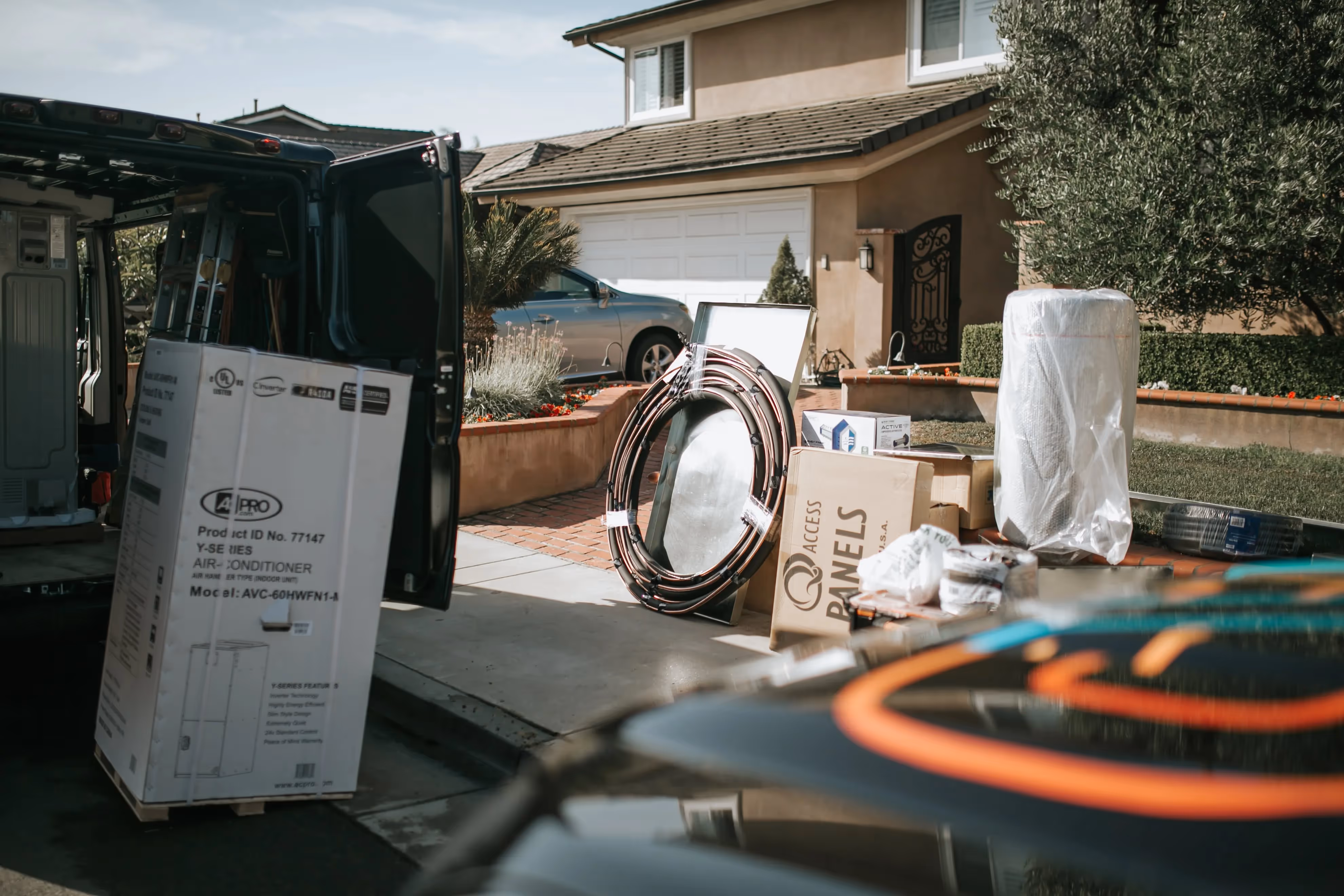 Air conditioner and installation materials in front of suburban home