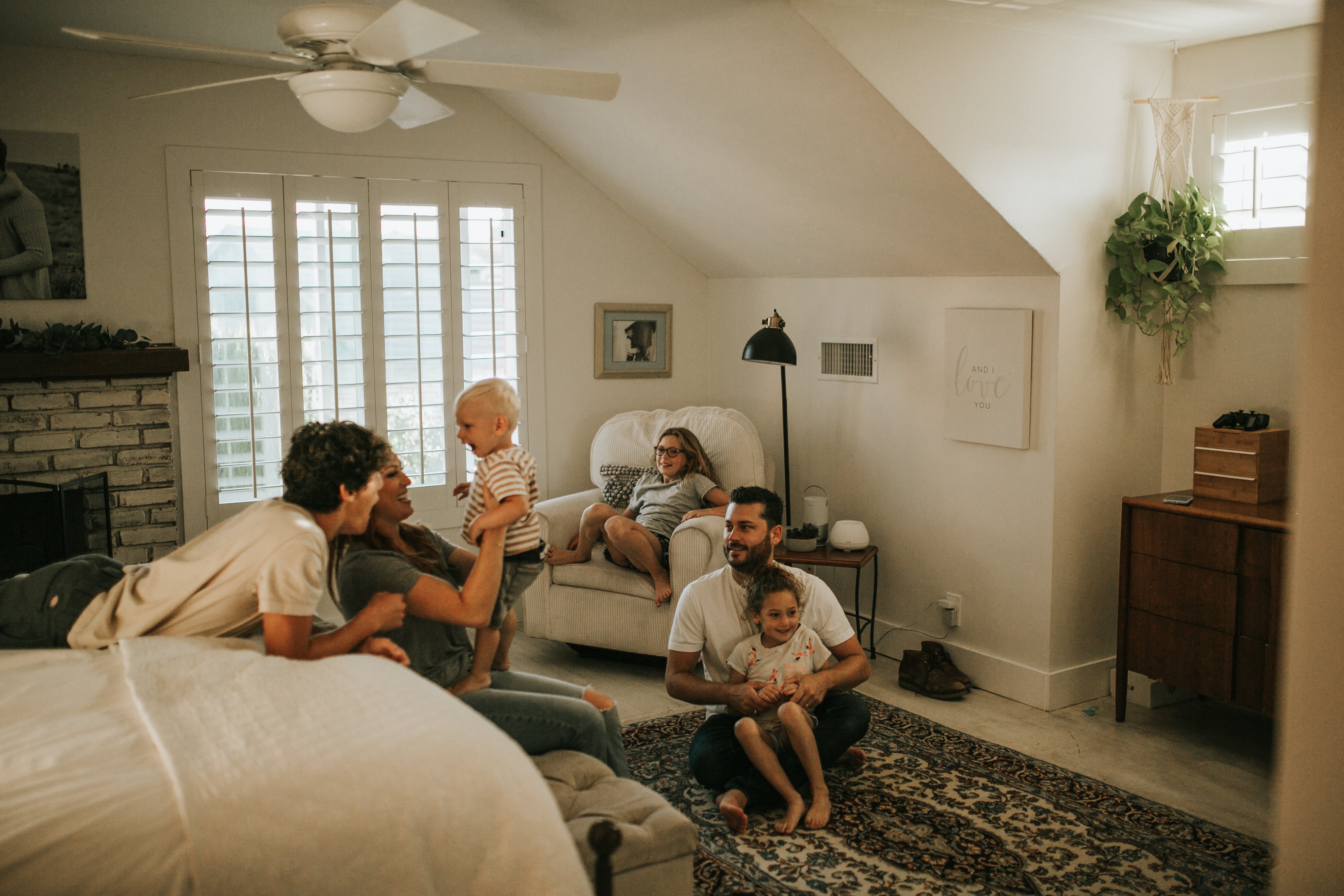 Cozy family relaxing together in bright living room with soft lighting