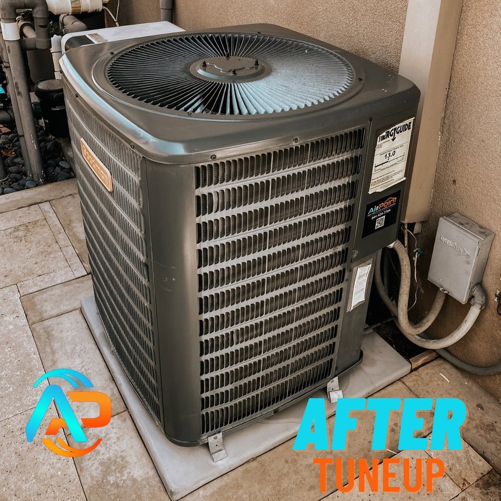 Outdoor air conditioning unit shown clean and serviced after professional AC tune-up, with AirPoint Heating & Air Conditioning branding