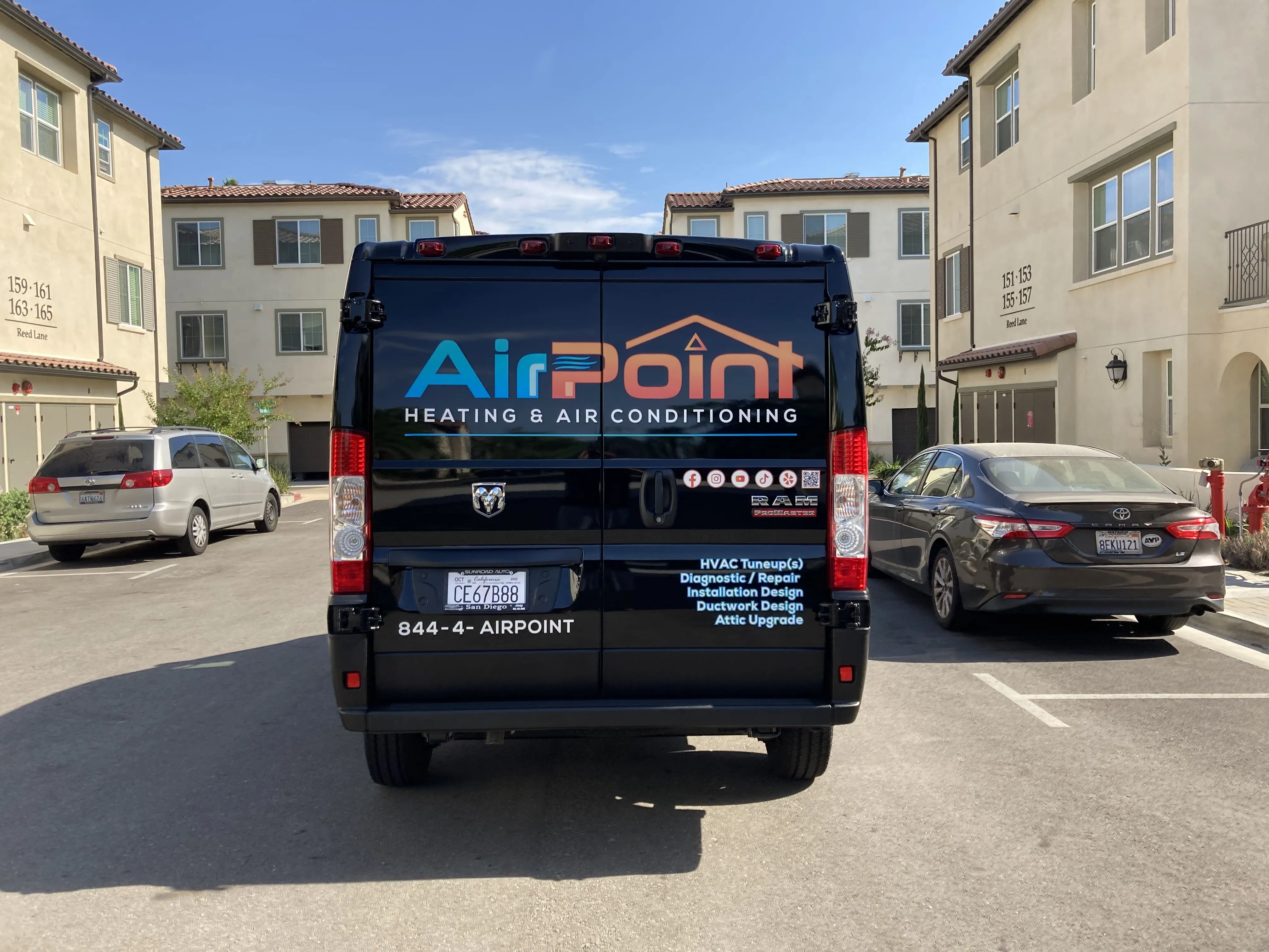 AirPoint Heating & Air Conditioning van parked in residential complex