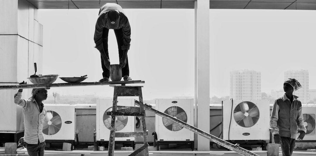 Technician using professional tools to inspect a furnace burner and heat exchanger in an Orange County home - is an hvac