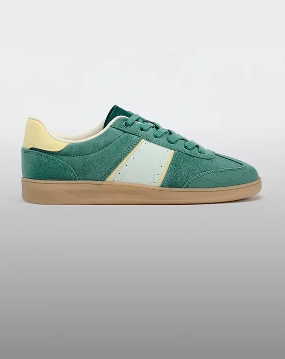 Stylish green suede sneakers with cream accents and gum sole – Zara-inspired casual footwear perfect for Aussie streetwear lovers.