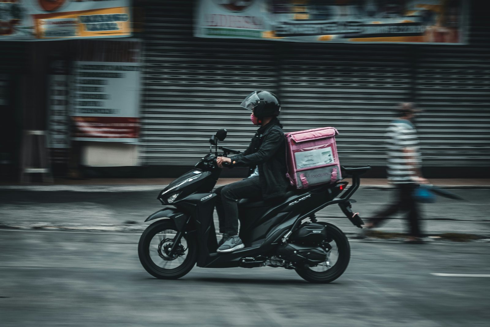 Gig delivery rider on a motorcycle
