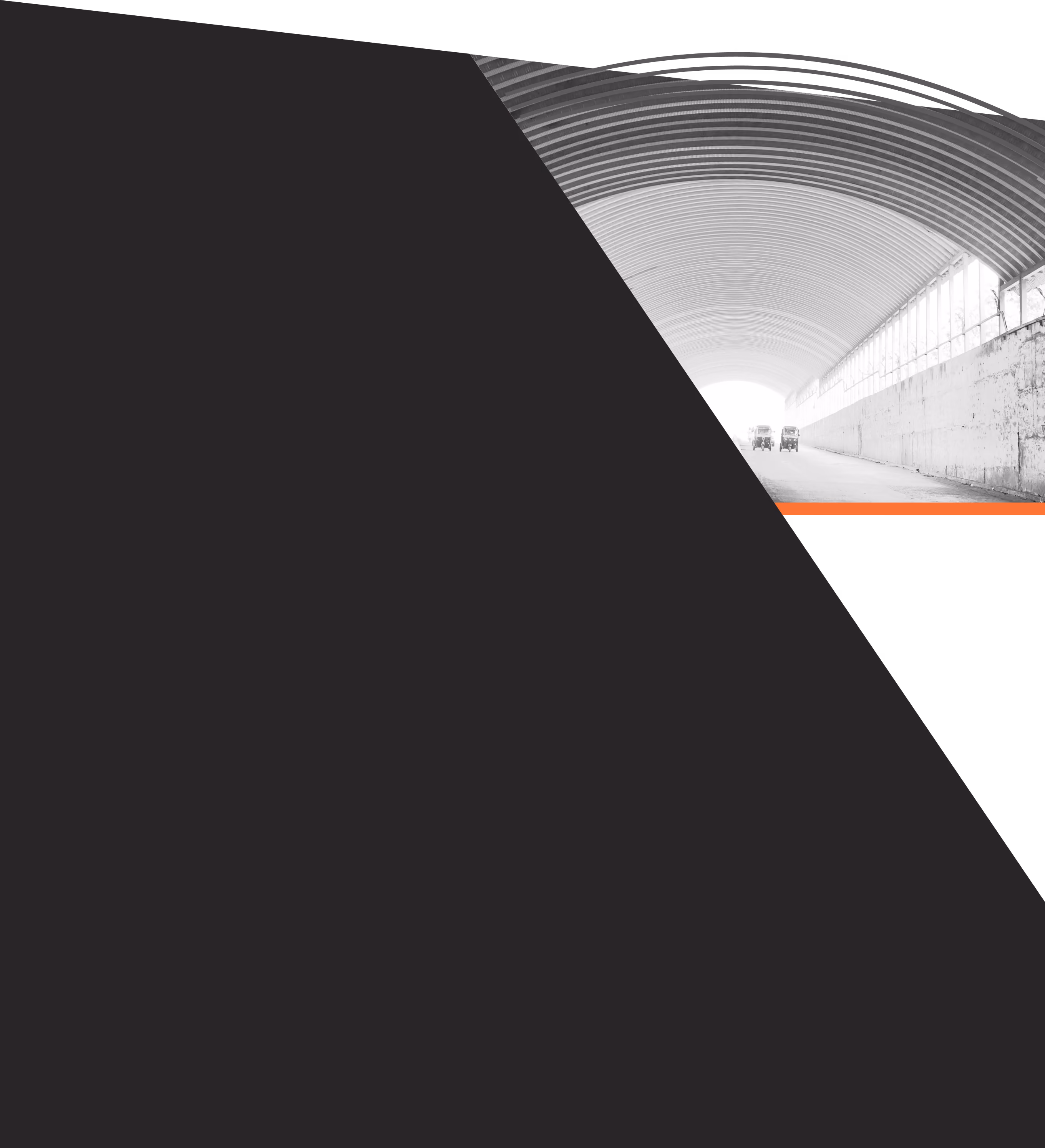 Diagonal view of arched warehouse on dark background
