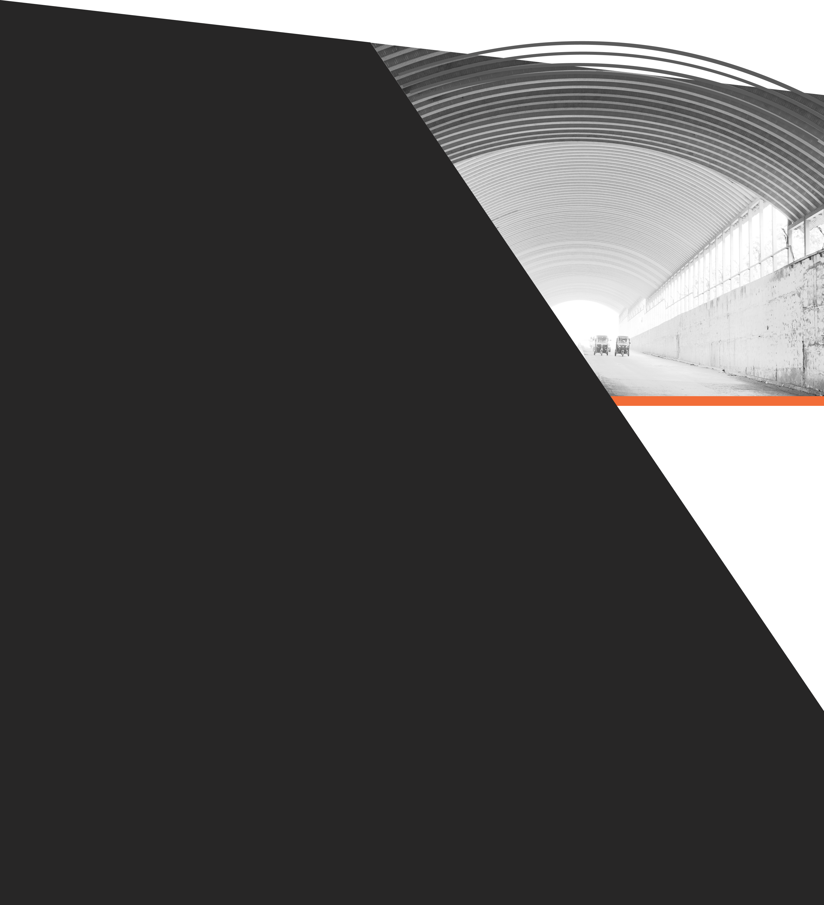 Diagonal view of arched warehouse on dark background