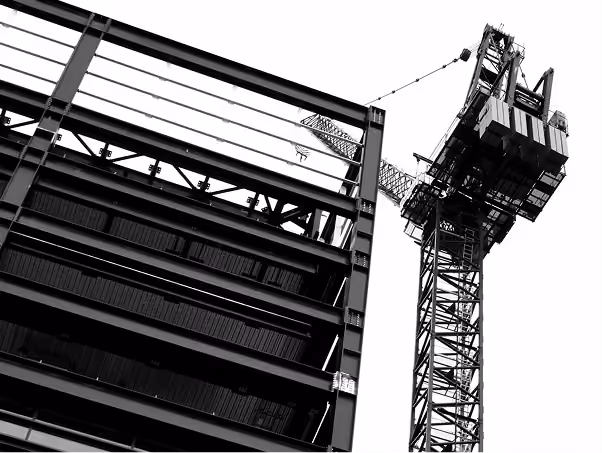 Crane Lifting Steel in Pre Engineered Buildings Construction