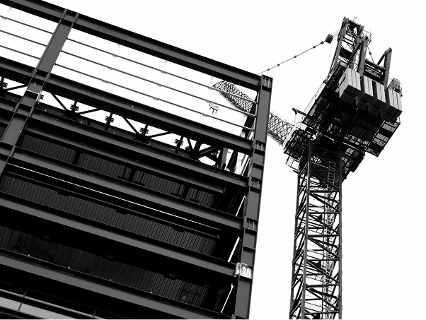 Crane Lifting Steel in Pre Engineered Buildings Construction