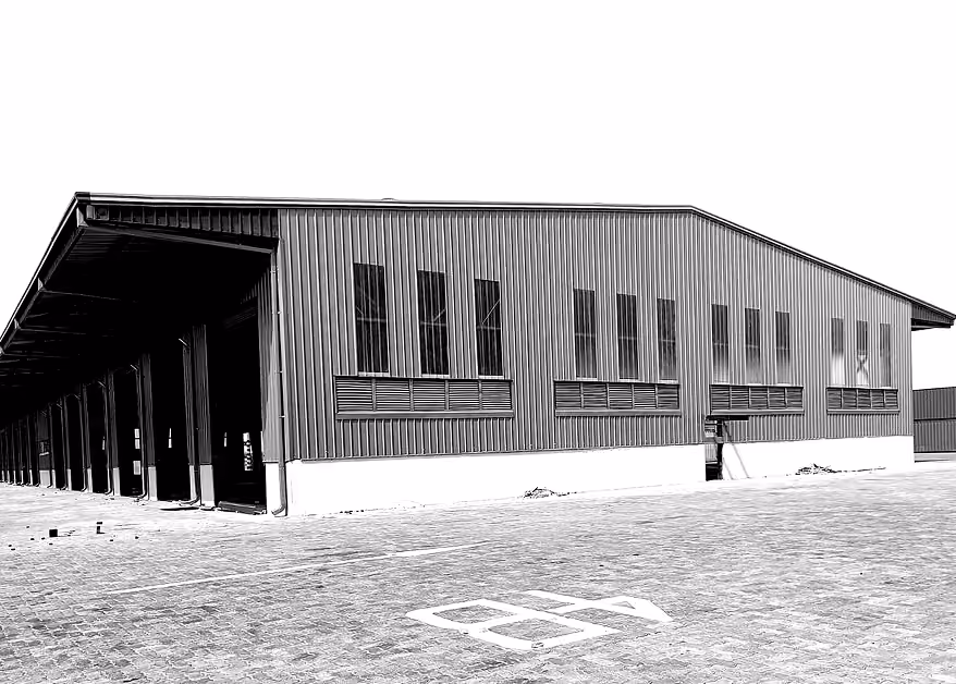 PEB warehouse exterior with multiple loading bays