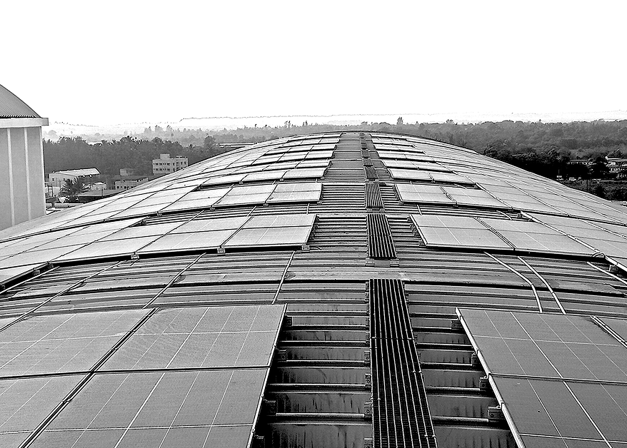 Roof mounted solar panels on curved steel structure