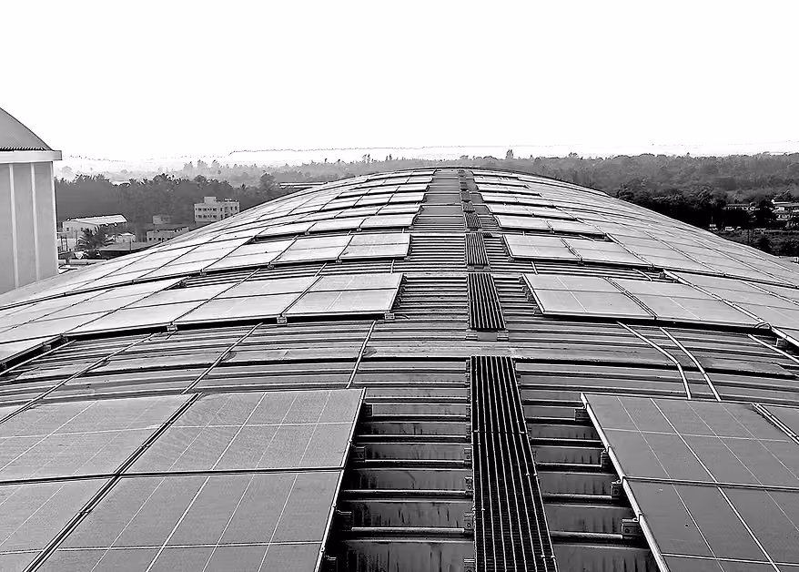 Roof mounted solar panels on curved steel structure
