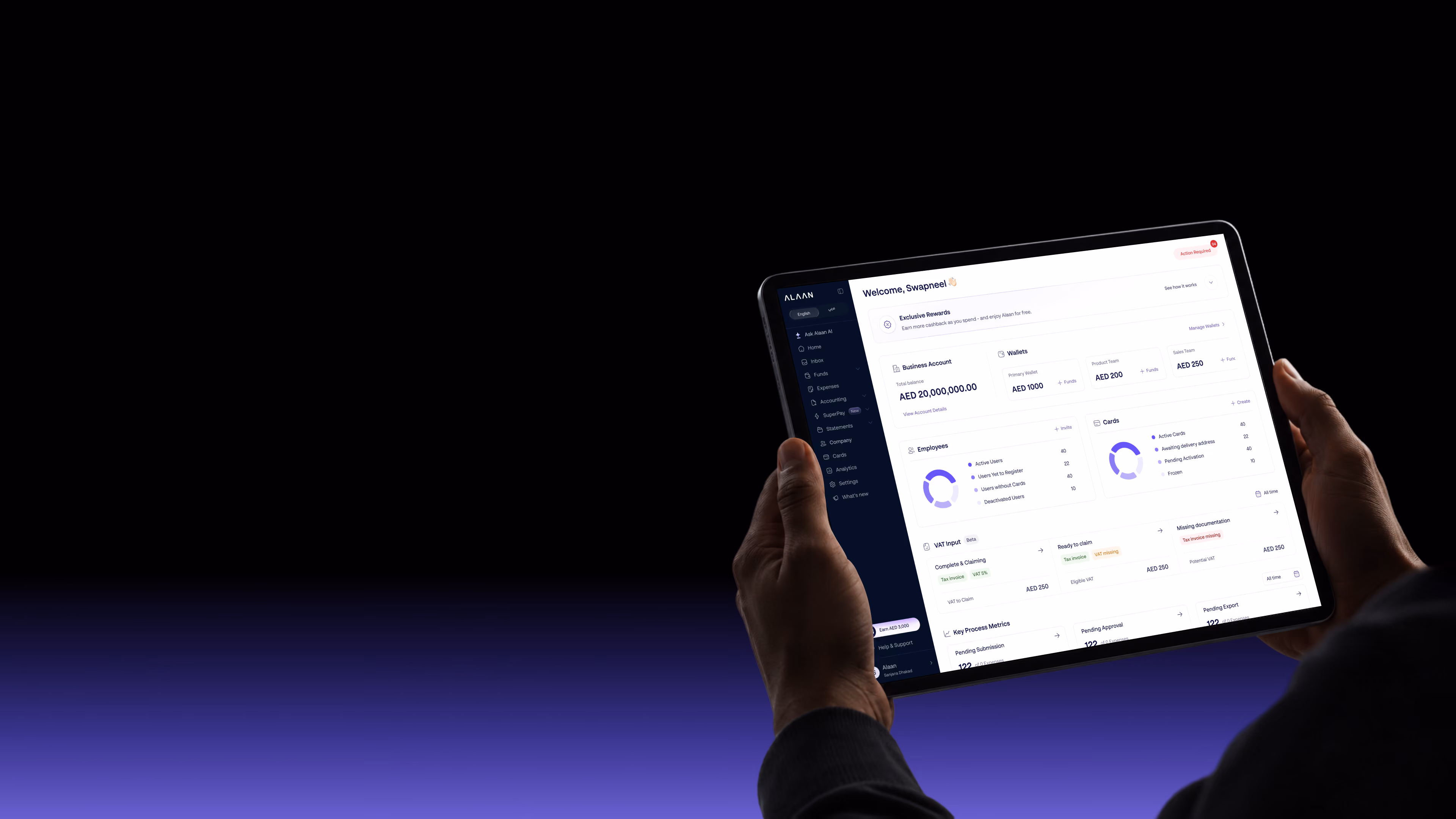 Hands holding a tablet displaying an expense management dashboard with financial data and charts on a dark background fading to purple at the bottom.