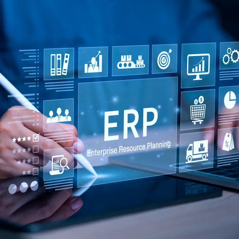 Hand using stylus on tablet with floating digital icons representing ERP and enterprise resource planning concepts.