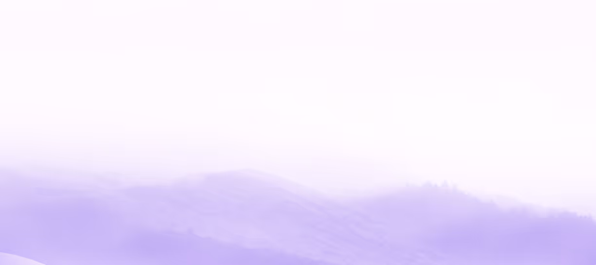 Soft purple and white gradient background resembling misty mountains or hills.