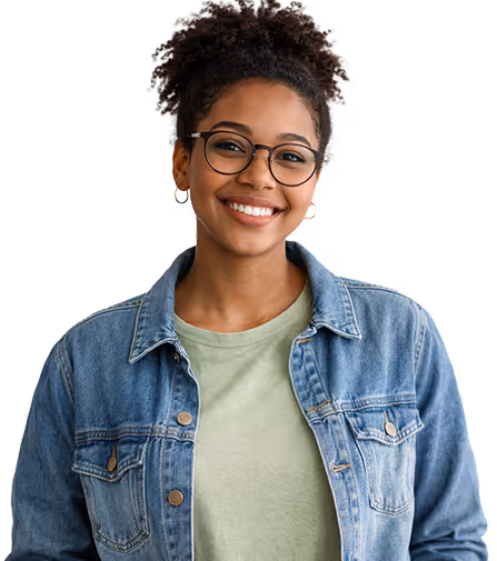 Smiling woman with curly hair in a bun wearing glasses, a light green shirt, and a denim jacket.