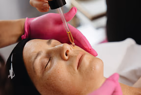 Facial serum application.