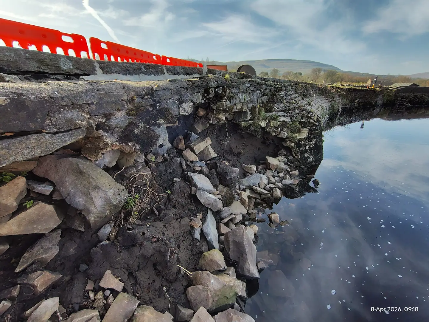 Storm damaged retaining wall and collapsed masonry at Haylands beside the River Ure