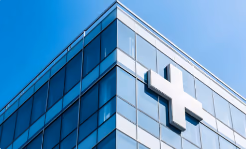Healthcare professionals walking through a modern hospital