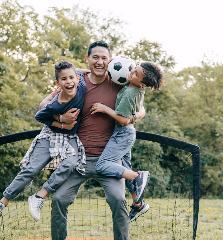 Dad playing with his two kids