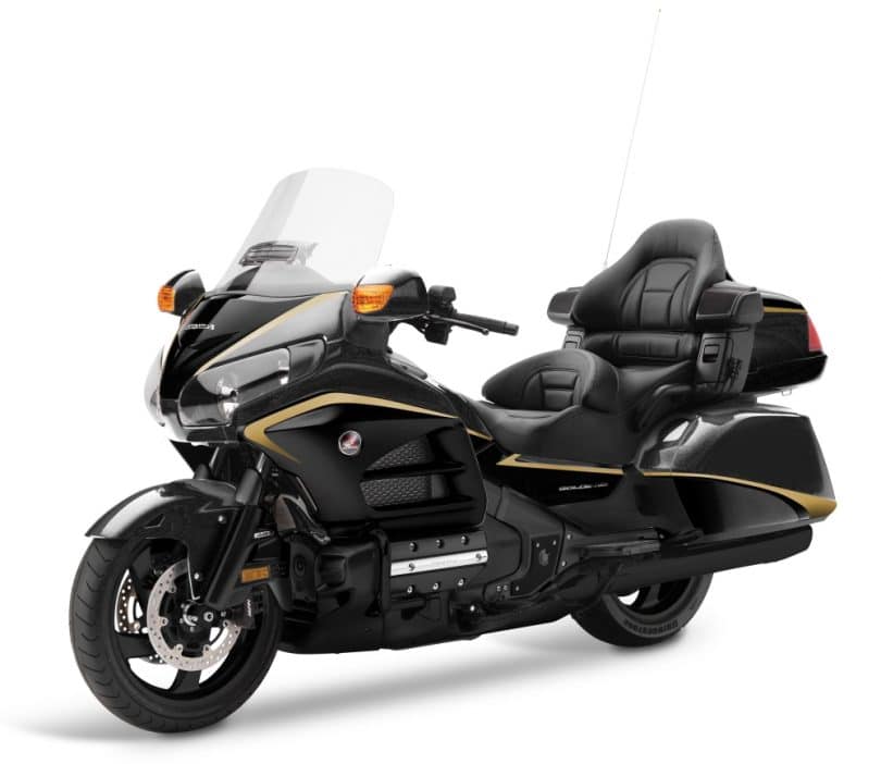 Black Honda Gold Wing touring motorcycle with aerodynamic fairing, large windscreen and premium passenger backrest, designed for fast and luxurious moto chauffeur services and VIP express transfers