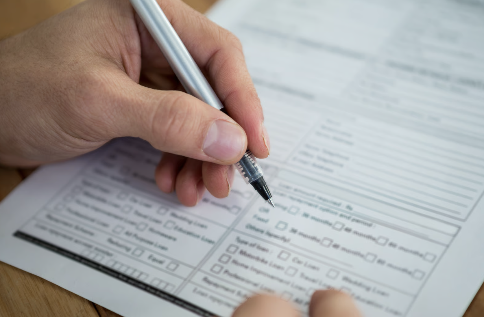 A businesswoman filling out a form.
