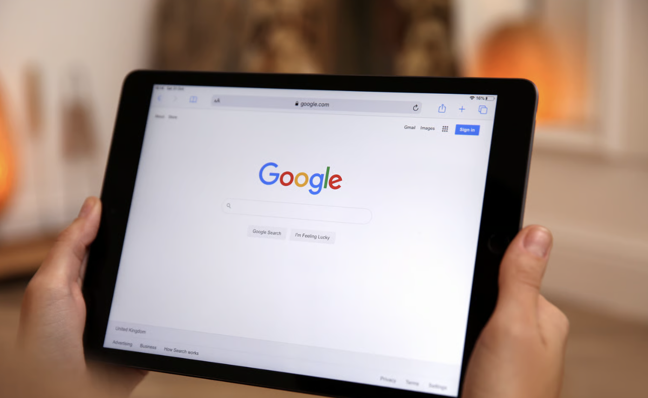 Woman using Google search engine on tablet indoors, closeup