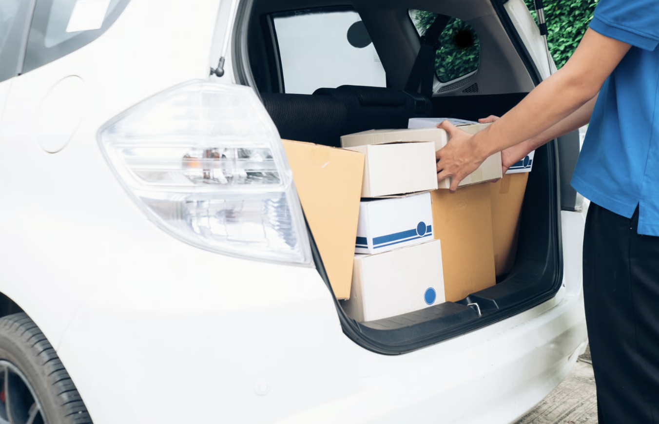 Loading Boxes Into a White Car