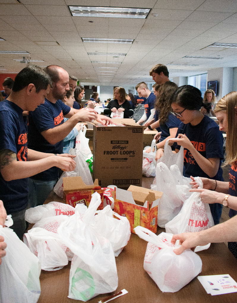Packing bags at the first Fooda Gives Back event in the Chicago HQ