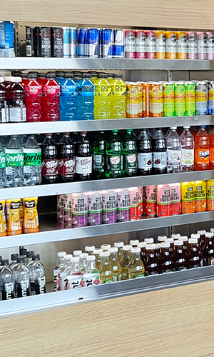 bottles and cans in a refrigerator