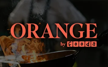 Orange by Fooda logo over image of a chef cooking