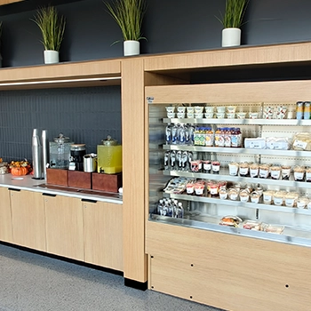 Refrigerated case of grab & go snacks along side coffee and drinks