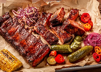 Platter of BBQ ribs and sides