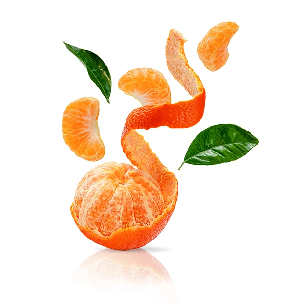 Peeled clementine with segments and peel spiraling upward alongside two green leaves.