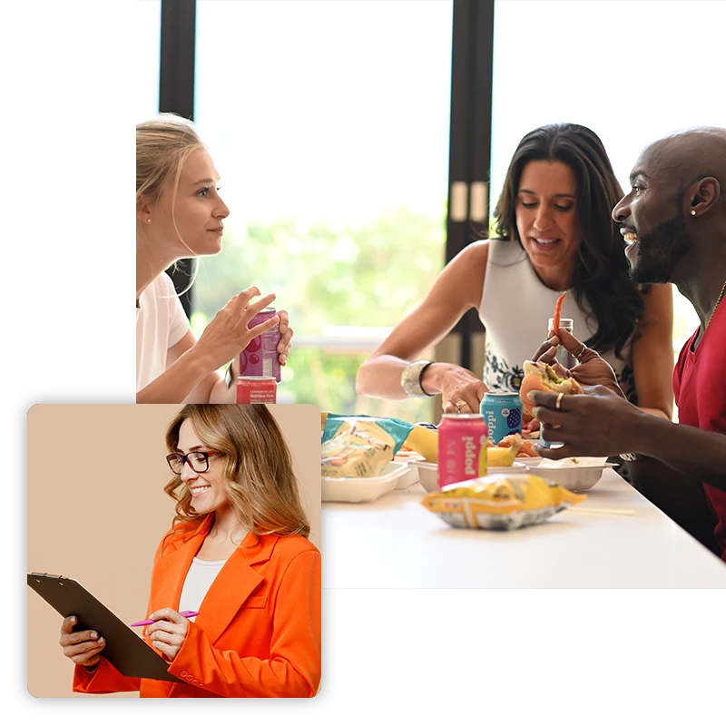 Three adults eating lunch together and a woman in an orange blazer holding a clipboard and pen.