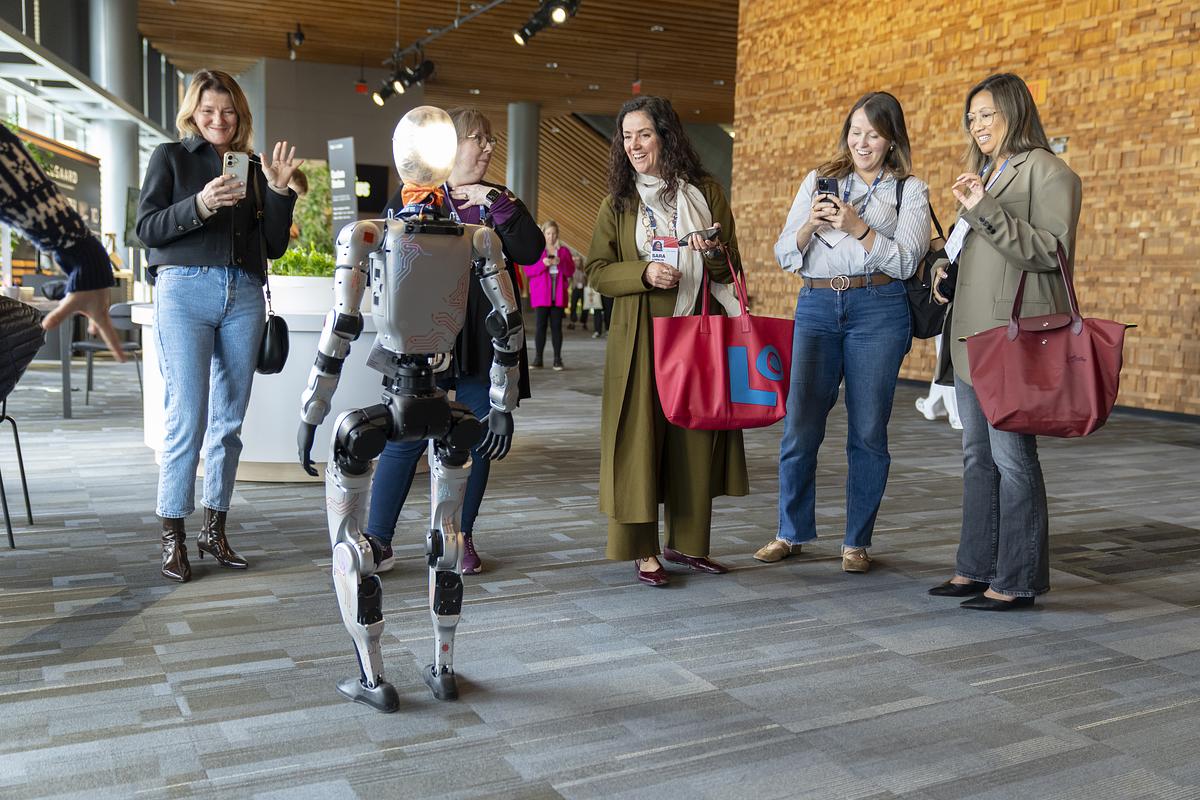 TED2027: Attendees engaged with robots