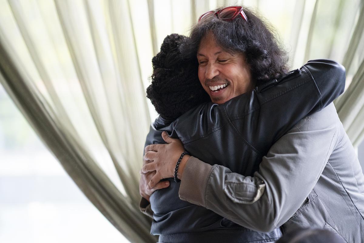 Two TED guests hugging
