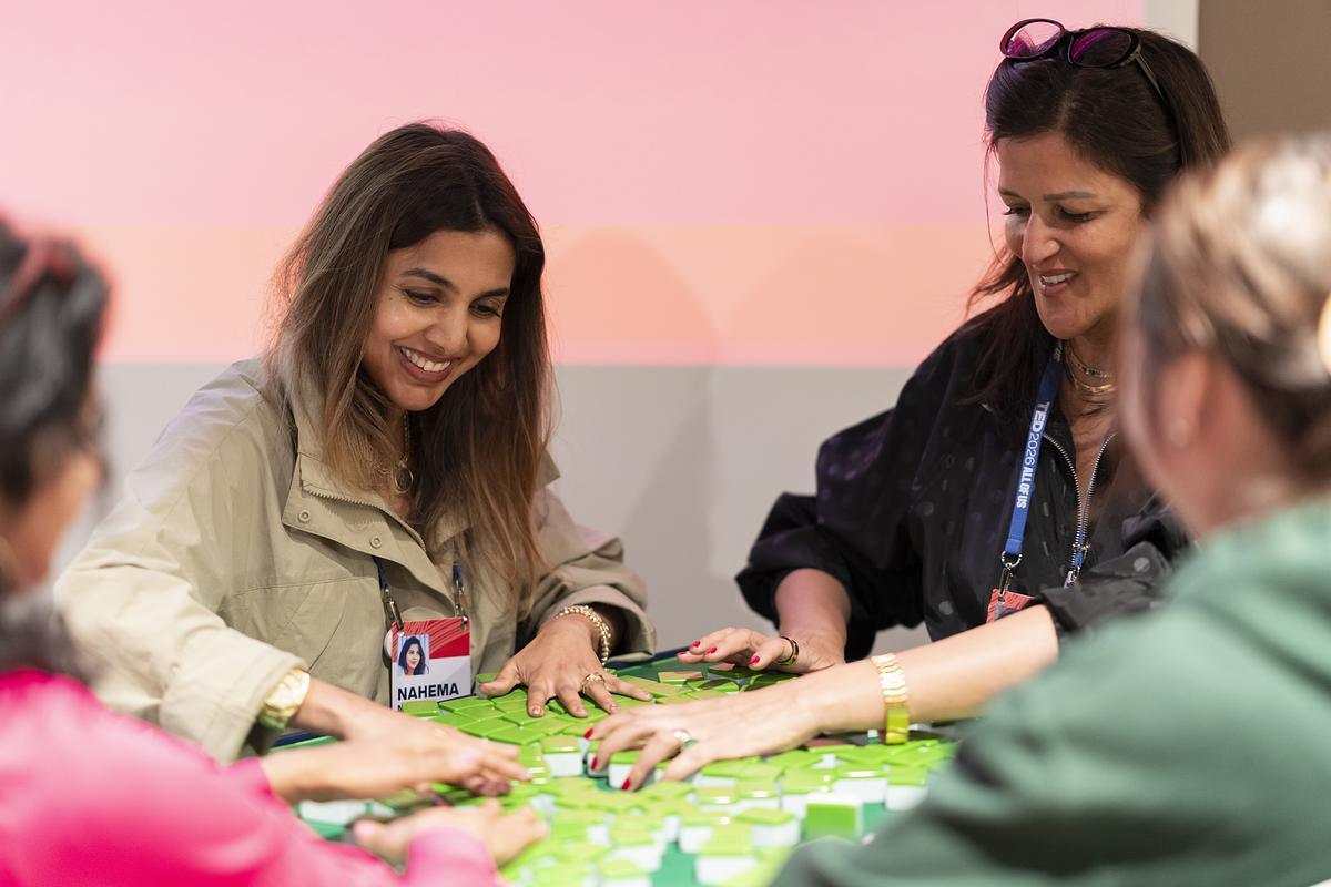 ted2026-people playing a game of mahjong-discovery session
