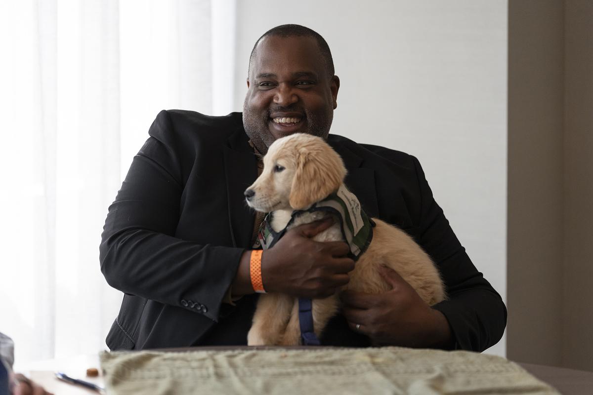 Person holding a puppy
