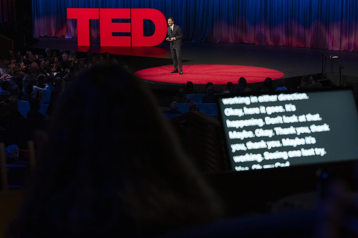Closed captioning during a TED Talk in the theater