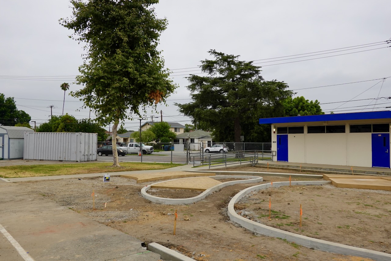 Cortada Elementary before renovation: unshaded walkways and sparse landscape.