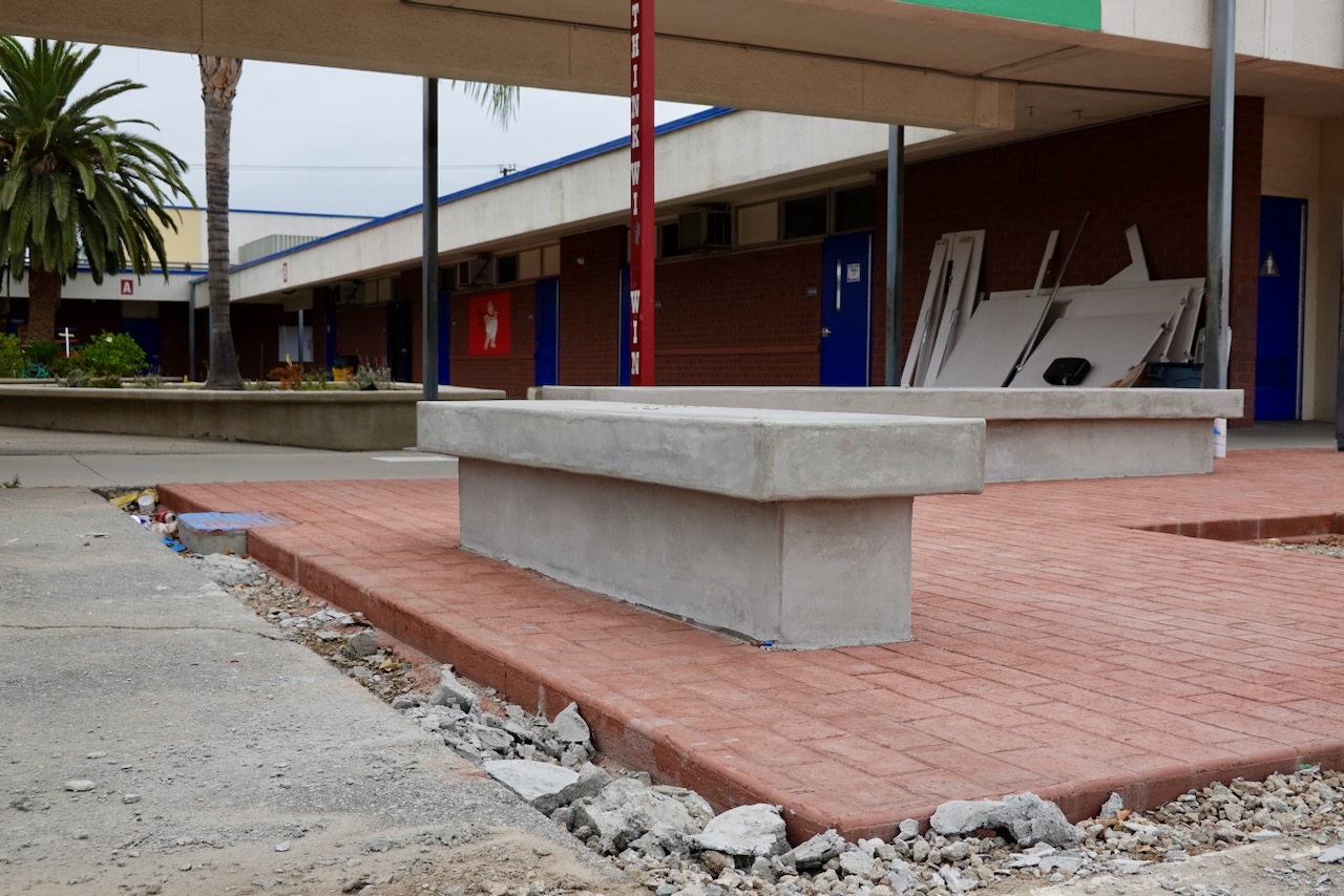 Cortada Elementary before renovation: hard surfaces and limited outdoor learning space.