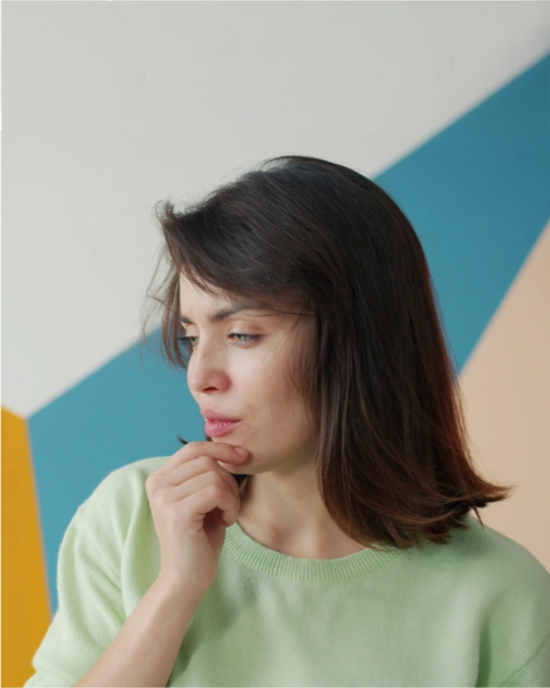 A woman lost in thought or deep in consideration