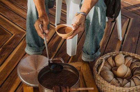 Cacao being prepared in a ceramic vessel
