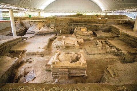 Preserved archaeological structures beneath protective roofing at Joya de Cerén