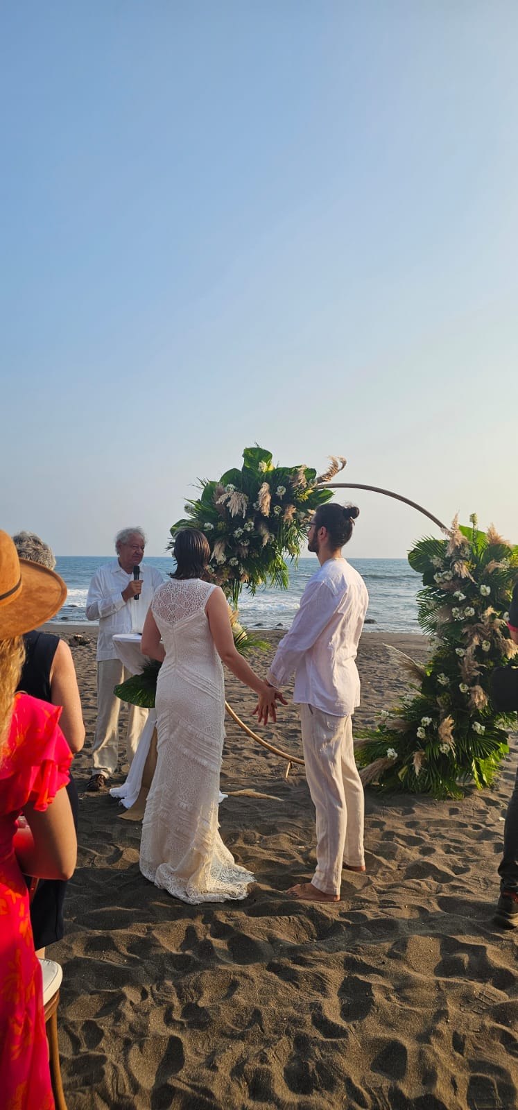 Couple exchanging vows on the beach