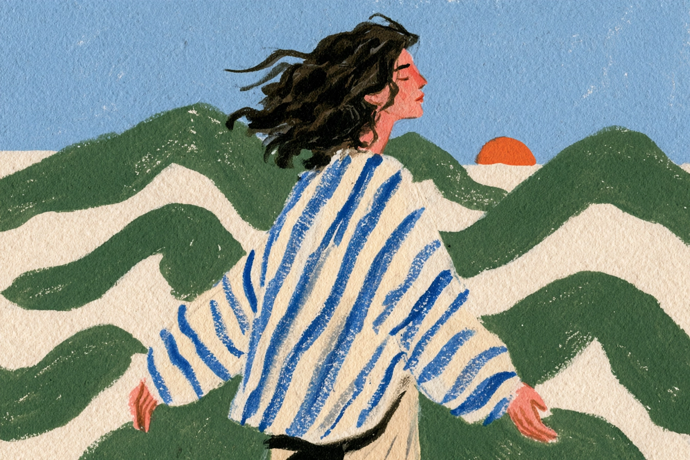 Woman breathing in fresh air by the sea