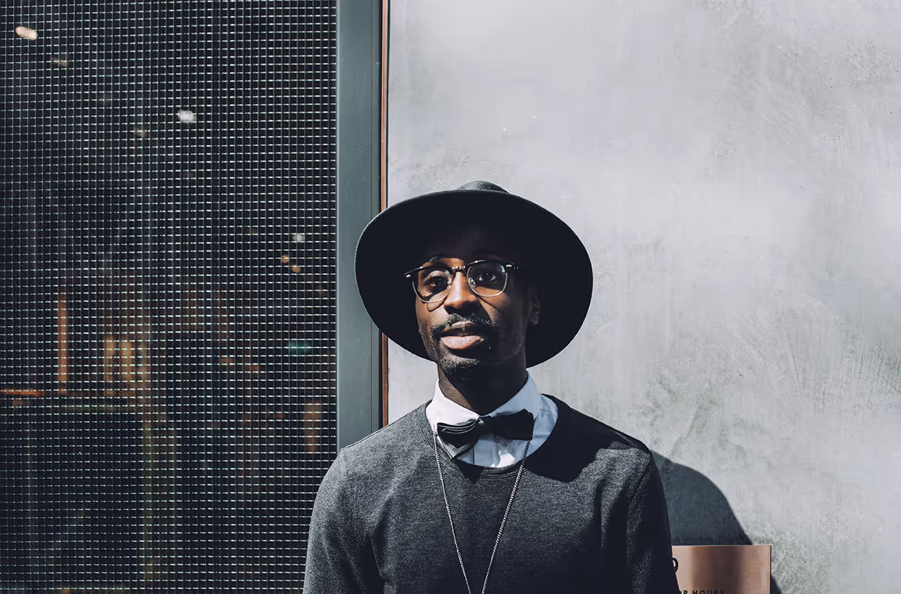 Man in hat and bow tie.