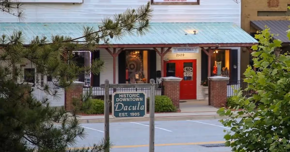 Historic downtown Dacula street view with red door and pine trees