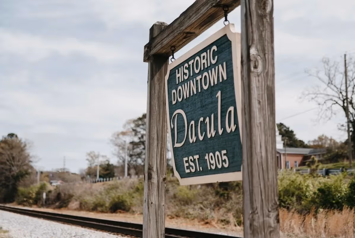 Historic downtown Dacula sign established in 1905 near railroad tracks