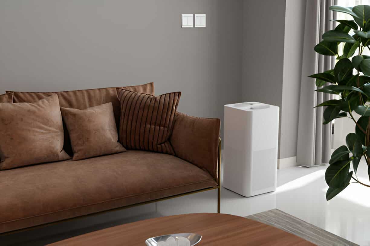 Modern living room with brown leather sofa, white air purifier, and plant